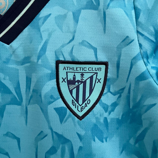 Kit Infantil Atlético de Bilbao II Castore 23/24 - Azul com detalhes em preto e branco