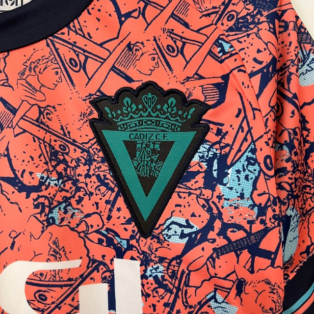 Kit Infantil Cadiz Edição Especial Macron 23/24 - Laranja com detalhes em azul e branco