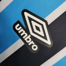 Camisa Grêmio I 23/24 -  Umbro Feminina - Azul com listras pretas e brancas