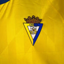 Kit Infantil Cadiz I Macron 23/24 - Amarelo com detalhes em azul