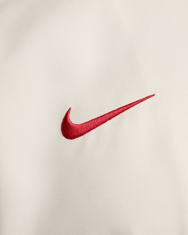 Jaqueta Corta-Vento Liverpool I 24/25 - Masculina Nike - Bege com detalhes em vermelho e preto