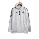 Jaqueta Corta-Vento Real Madrid 23/24 - Masculina Adidas - Branca com listras pretas