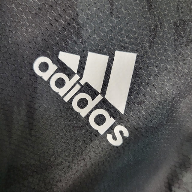 Jaqueta Corta-Vento Real Madrid 23/24 - Masculina Adidas - Preta