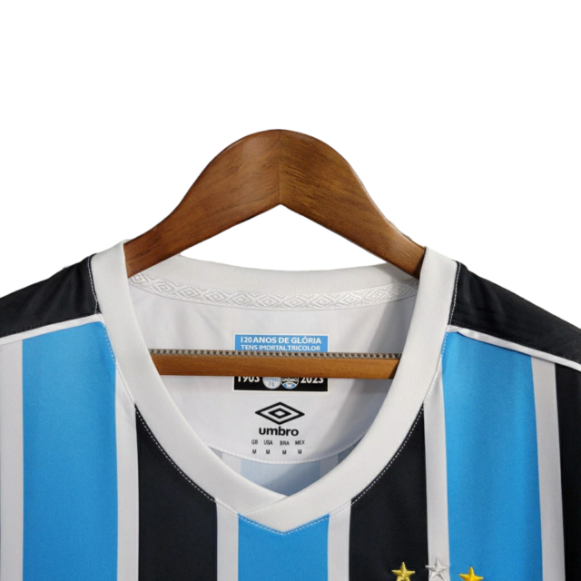 Camisa Grêmio I 23/24 -  Umbro Feminina - Azul com listras pretas e brancas