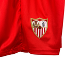 Kit Infantil Sevilla II Castore 23/24 - Vermelho com ondulações cinza e dourado