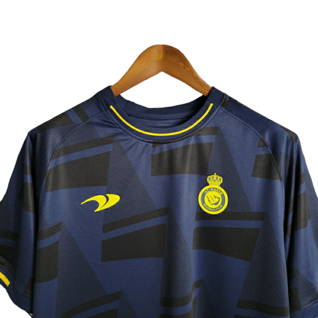 Camisa Al-Nassr Treino 23/24 - Torcedor Dunes Masculina - Azul com detalhes em preto e amarelo