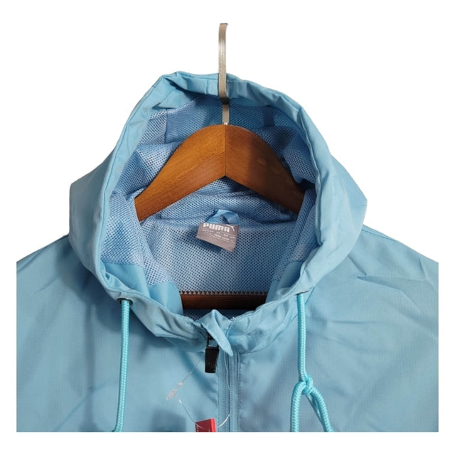 Jaqueta Corta-Vento Manchester City 23/24 - Masculina Puma - Azul com detalhes em branco