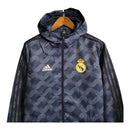 Jaqueta Corta-Vento Real Madrid II 23/24 - Masculina Adidas - Azul com listras pretas