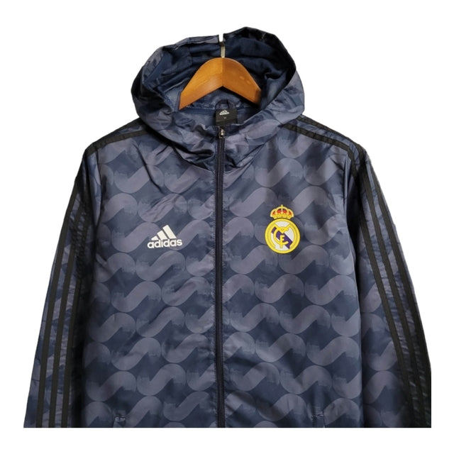 Jaqueta Corta-Vento Real Madrid II 23/24 - Masculina Adidas - Azul com listras pretas