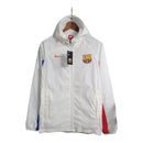 Jaqueta Corta-Vento Barcelona 23/24 - Branca com detalhes em vermelho e azul