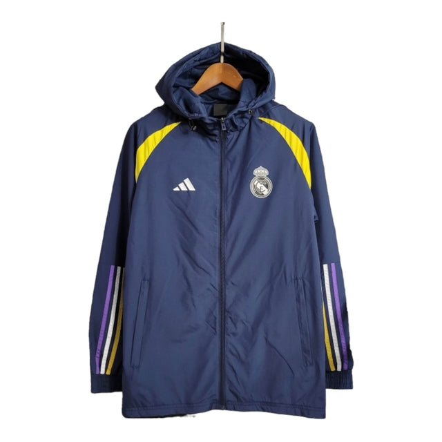 Jaqueta Corta-Vento Real Madrid 23/24 - Masculina Adidas - Azul com detalhes em amarelo