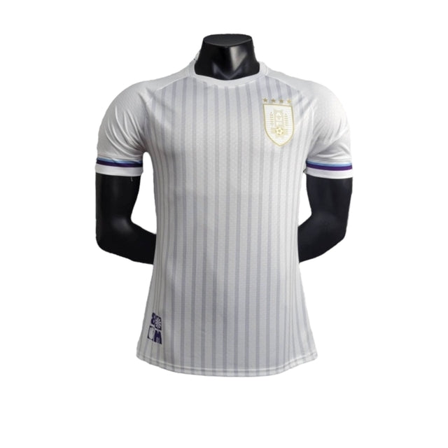 Camisa Seleção do Uruguai I 24/25 - Jogador Masculina - Branca com detalhes em azul e dourado
